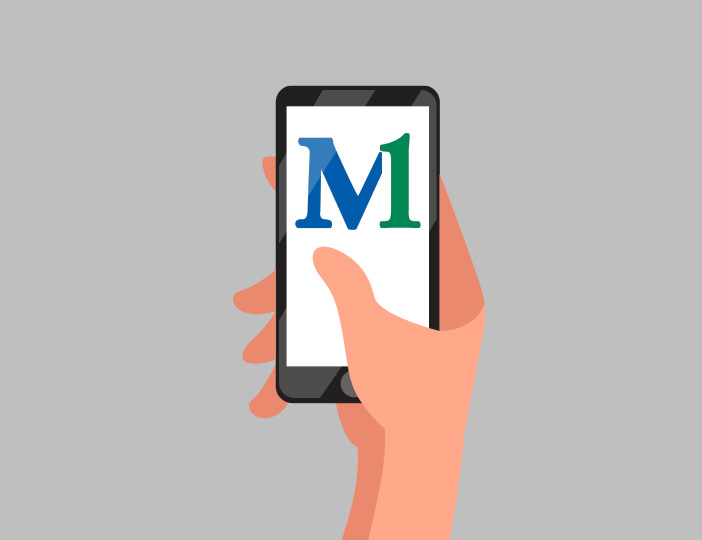 Hand holding smartphone with M1 Credit Union mobile banking app open, showing convenient digital account access on the go.
